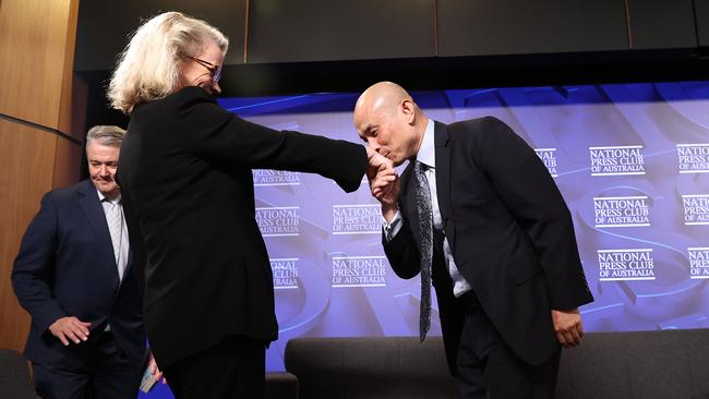 Chinese embassy spokesman Wang Xining greets moderator Laura Tingle at the National Press Club on Wednesday. Picture: Gary Ramage