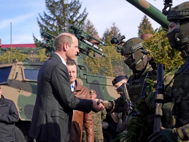 Prince William with Polish troops and Polish Deputy Prime Minister, Mariusz Blaszczak. Picture: Getty Images