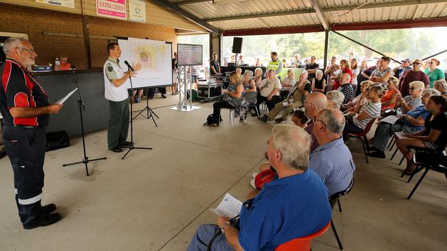 Local residents attend a community meeting to find out information about the Bunyip state forest bushfire. Picture: Stuart McEvoy