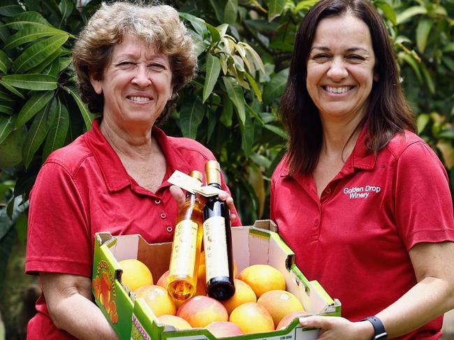 The increase in tourism numbers to Cairns has also seen an increase in tourists looking to add authentic rural and regional experiences to their Far North Queensland holiday. Golden Drop Winery director Maria Nastasi and cellar door manager Grace Parker have seen more tourists visiting their Biboora orchard and sampling the mango wine and liqueurs on sale. Picture: Brendan Radke