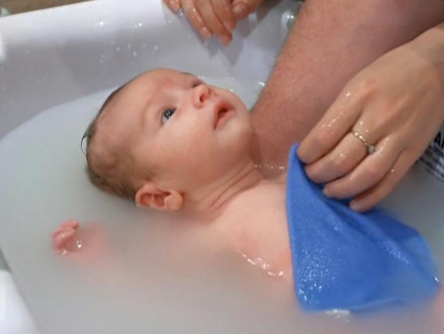 Barnaby Joyce and Vikki Campion show off baby Sebastian. Photo credit: Channel 7