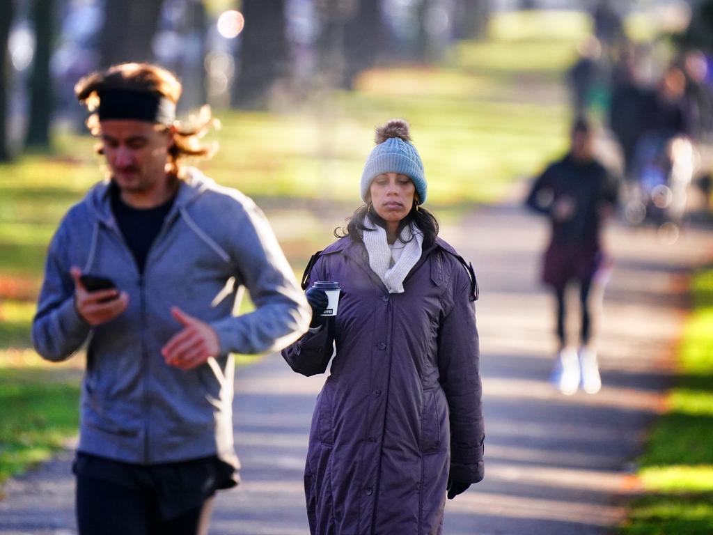 Melburnians feel the winter chill at Royal Park in Parkville. Picture: NewsWire / Luis Enrique Ascui