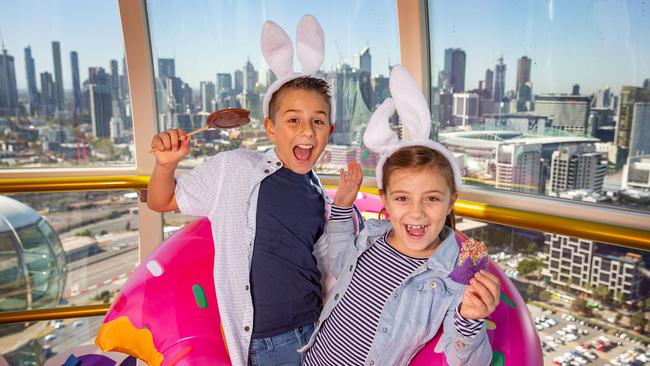 Murat, 10, and Larah, 8, get into the Easter spirit at the Melbourne Star Observation Wheel. Picture: Sarah Matray