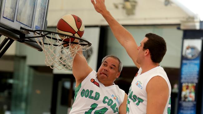 Gold Coast Mayor Tom Tate tries his hand against former Gold Coast Blaze player Jaydan Tom at the Broadbeach Mall. The mayor has added his voice to calls for a Gold Coast team in the NBL. Picture: Tim Marsden