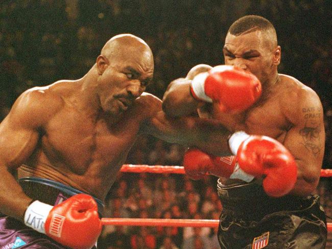 10/11/1996 PIRATE: Mike Tyson connects with a blow to Evander Holyfield during their bout at the MGM Grand Garden in Las Vegas, Nevada. Hoyander won the fight by a TKO.  Mandatory Credit, Al Bello/ALLSPORT/Aust Pict Library. a/ct. 9 November 1996./boxing