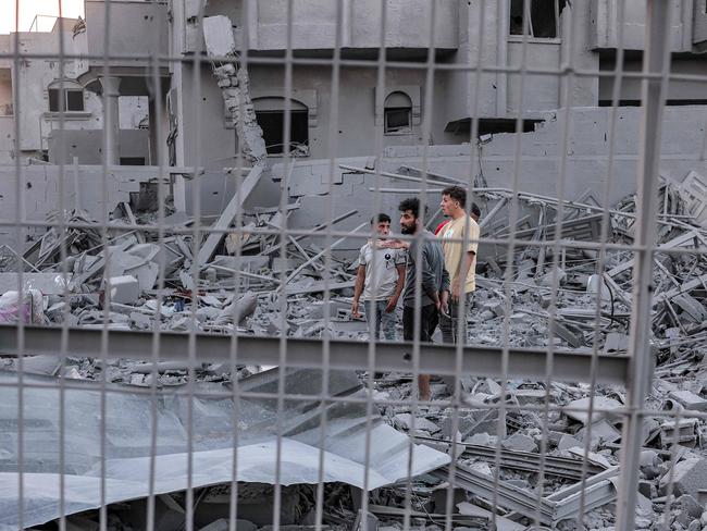 People search rubble for survivors and the bodies of victims in the aftermath of Israeli bombardment in Rafah in the southern Gaza Strip. Picture: AFP