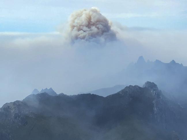 Smoke from fires in the Tasmanian Wilderness World Heritage Area rises behind Federation Peak (right, distance). Picture: MARK HOLDSWORTH 