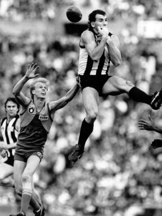 Darren Millane flies high during the 1990 finals series. He was among the Pies’ best that year