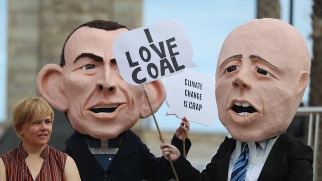 GetUp! parading giant Peter Dutton and Tony Abbott heads while calling for politicians to show climate leadership. Picture: Tait Schmaal