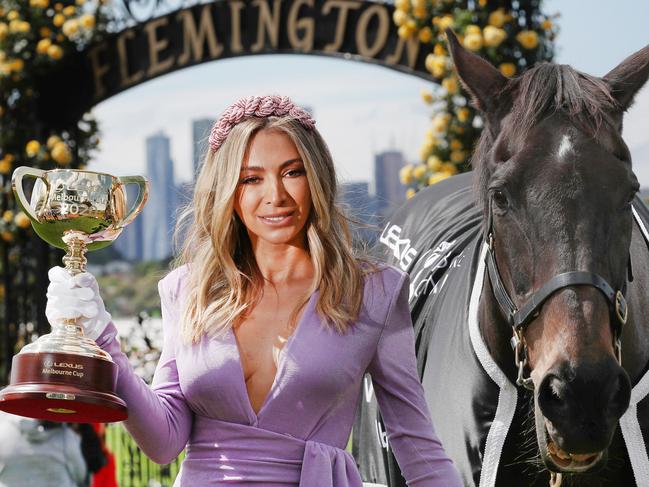 MELBOURNE, AUSTRALIA- NewsWire Photos OCTOBER 27, 2020: Melbourne Cup Carnival Ambassador Nadia Bartel with 2000 Melbourne Cup winner Brew at the Melbourne Cup Carnival Media Call in at The Mounting Yard in Flemington Racecourse. Picture: NCA NewsWire/ David Crosling