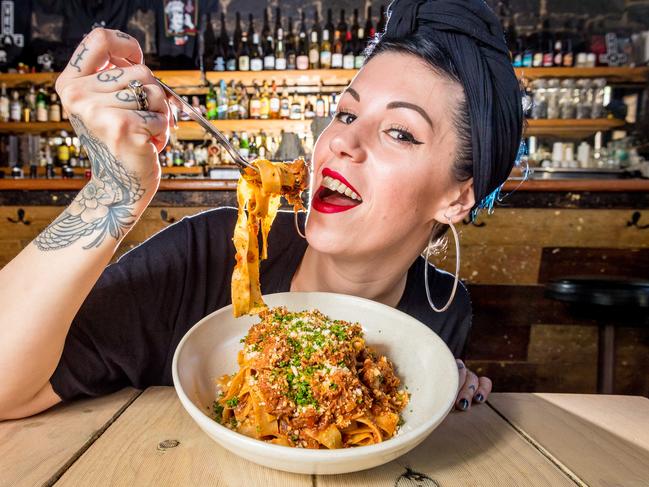 Vegan restaurant Smith and Daughters owner Shannon Martinez tucks into a vegan slow braised beef ragu on pappardelle (made from mushrooms). Picture: Jake Nowakowski