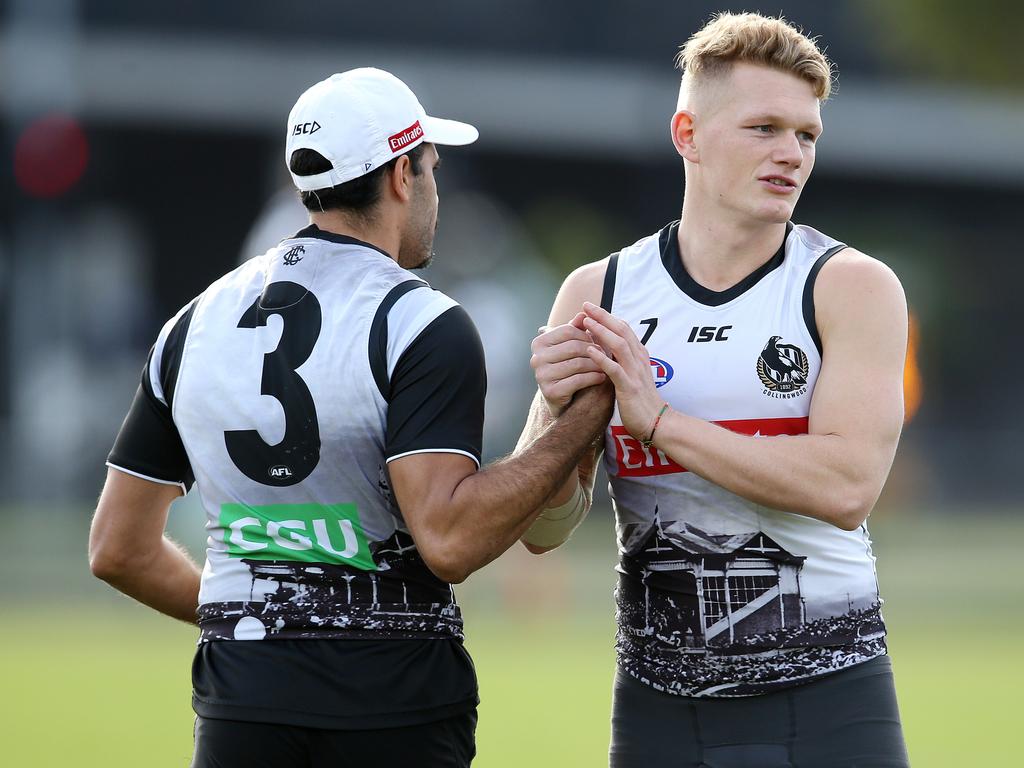 Collingwood training at Olympic Park.  Daniel Wells and Adam Treloar shake hands    . Pic: Michael Klein