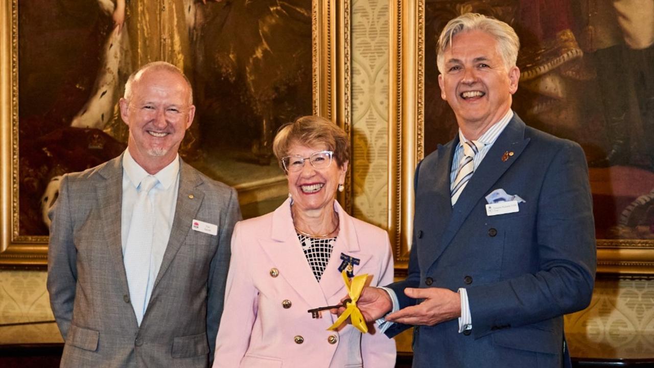 Heritage New South Wales director of assessments Tim Smith and Governor of NSW Margaret Beazley formally handover the keys to Hillview to Dominic Richards.