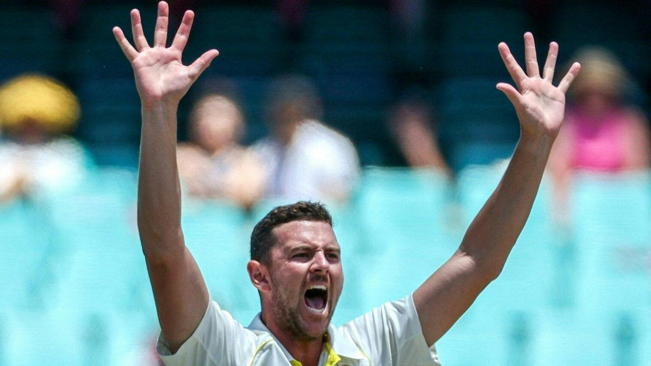 Josh Hazlewood appeals successfully for LBW to dismiss South Africa’s Keshav Maharaj on day five.