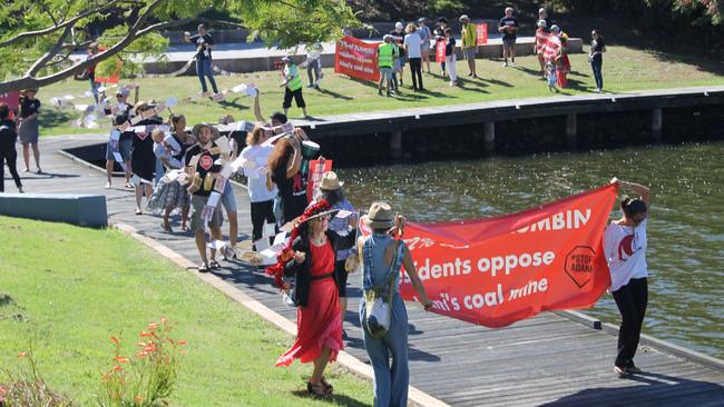 Stop Adani Gold Coast protesters form a conga line to the office of McPherson MP Karen Andrews at Varsity Lakes today. 