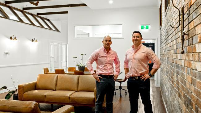 FOR SALE: LJ Hooker's Markus Eames and Dan Cullinane stand inside 300 Ruthven St, Toowoomba City.