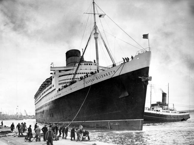 A tug pushes the ocean liner Queen Elizabeth to the dock at Southhampton in 1946.