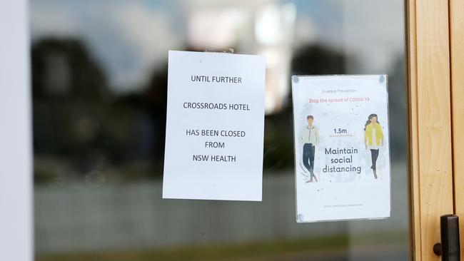 A notice on the door of The Crossroads Hotel in Casula, which has been identified as a COVID-19 hotspot in southwest Sydney. Picture: Richard Dobson