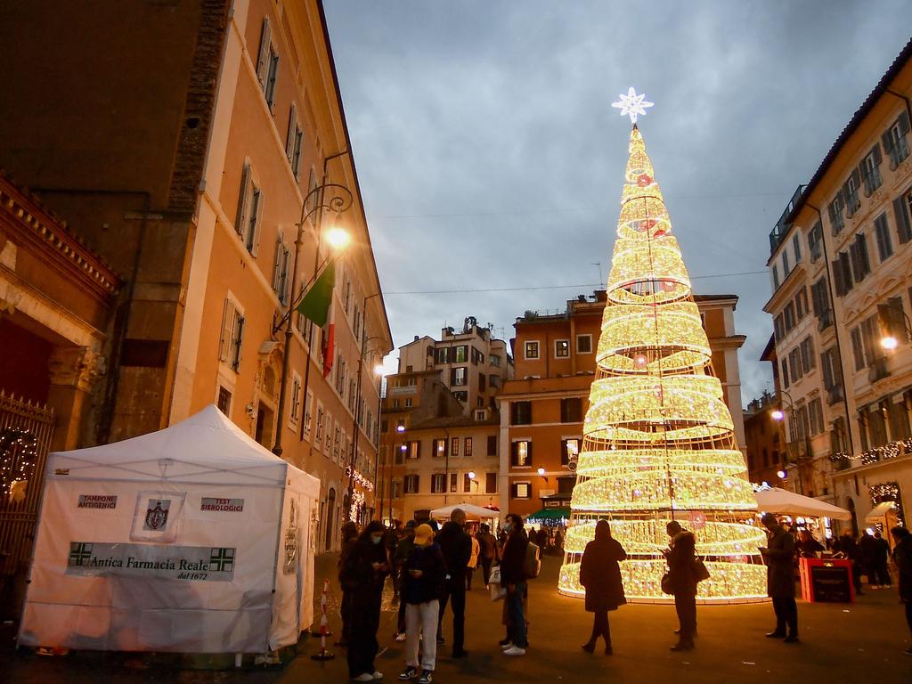 People wait outside a pharmacy to get tested for Covid-19 in Rome. Picture: Filippo Monteforte/AFP