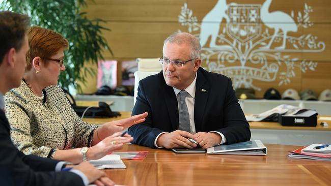 Foreign Minister Marise Payne speaks with the PM at the Commonwealth Parliament Offices in Sydney on Monday. Picture: AAP/Joel Carrett