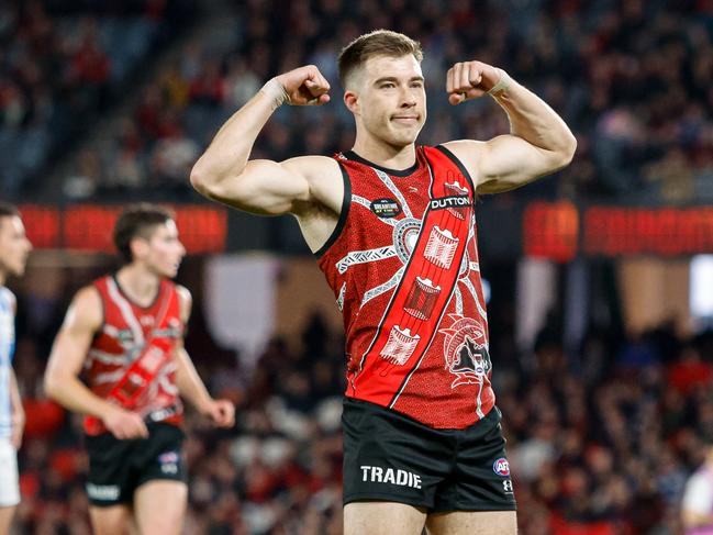 Zach Merrett of the Bombers celebrates a goal. Picture: Dylan Burns/AFL Photos via Getty Images.