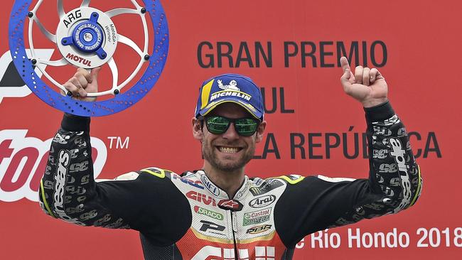 Honda biker Cal Crutchlow of Great Britain celebrates in the podium after winning the MotoGP race of the Argentina Grand Prix at Termas de Rio Hondo circuit, in Santiago del Estero, Argentina on April 8, 2018. / AFP PHOTO / JUAN MABROMATA