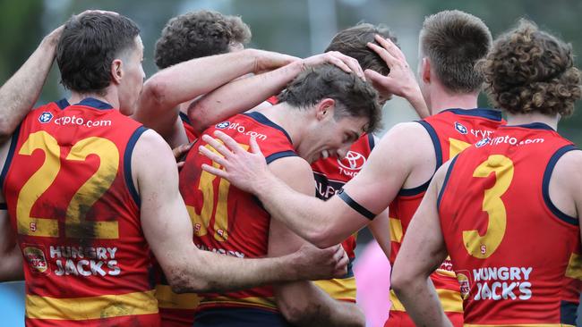 Billy Dowling from the Crows (centre) celebrates a goal with team mates during the Round 17 SANFL match between Sturt and Adelaide at Unley Oval in Adelaide, Saturday, August 19, 2023. (SANFL Image/David Mariuz)