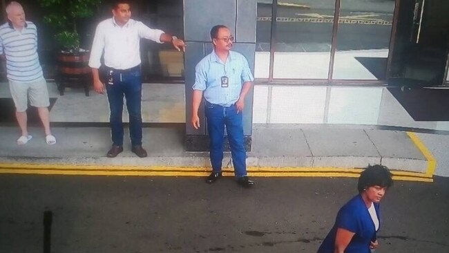 Security camera footage of Annapuranee Jenkins outside Hotel Jen in Penang, Malaysia, about 2.45pm on December 13, 2017. Her husband Frank Jenkins, far left, watches on.