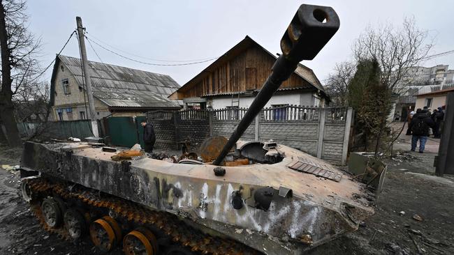 A destroyed armoured vehicle in the town of Bucha, on the outskirts of Kyiv. Picture: AFP