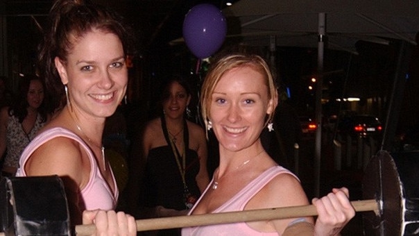 Jenny Paolucci (correct) and Dee Cox on Flinders Street East Pic Bryan Lynch AD076044