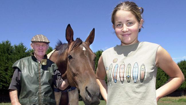 A 15-year-old Michelle Payne with trainer father Paddy in 2001. Picture: Michael Perini.