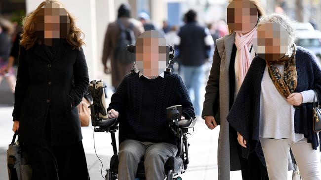 The man charged with attempted murder arrives at court with supporters before his trial. Picture: Mark Brake/AAP