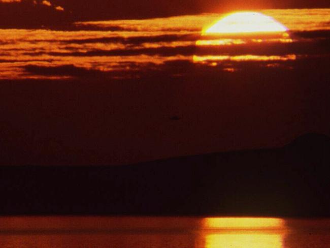 Sun sets over a lagoon in Coorong National Park. Pic SA Tourist Commission.South Australia / SunsetTravel