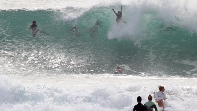 Many didn’t take heed of warnings to stay out of the water this week, instead taking advantage of the great surfing conditions. Picture: Mike Batterham