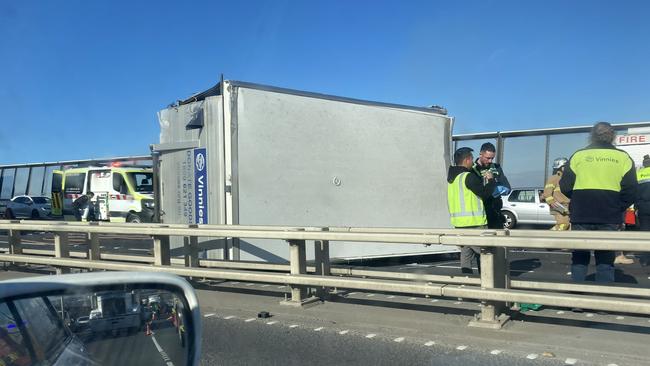 The Vinnies truck on its side following the crash. Picture: Brianna Travers