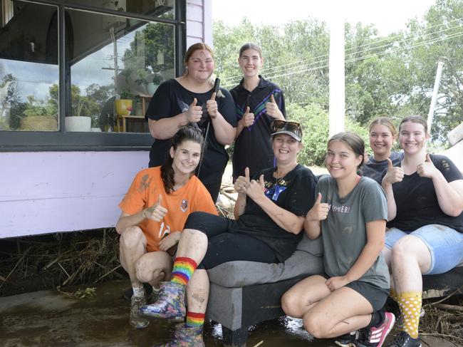 A crew of locals united to help clean up the mess after the water receded and revealed the devastation of the floods over the weekend.