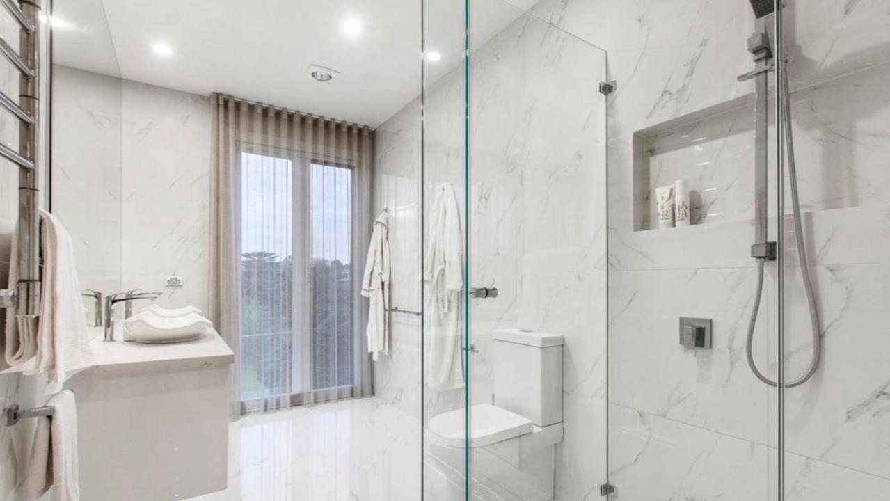 One of six designer bathrooms, featuring sleek finishes and modern luxury to match the home’s prestige appeal.