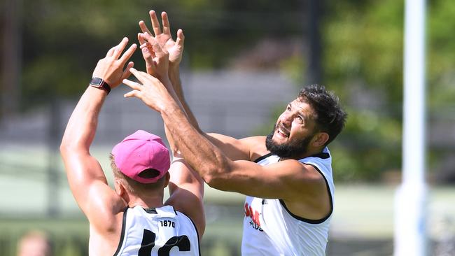 Paddy Ryder marks over Ollie Wines during Port Power training session at Alberton Oval. The team is embracing Adelaide’s hot spell. Picture: AAP Image/Mark Brake) NO ARCHIVING