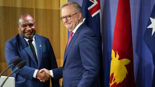 Australian Prime Minister Anthony Albanese (R) shakes hands with Papua New Guinea's Prime Minister James Marape during a press conference in Sydney.