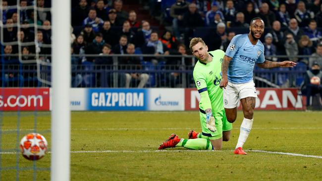 Raheem Sterling rolls home the winner past Ralf Faehrmann.