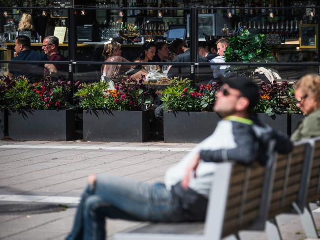 People sit in a restaurant in Stockholm. Picture: AFP