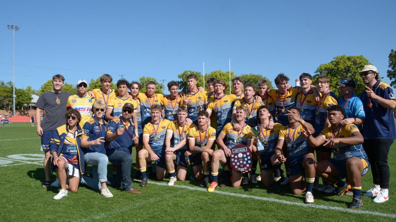 Highfields Eagles Under 19 men celebrate their premiership win.