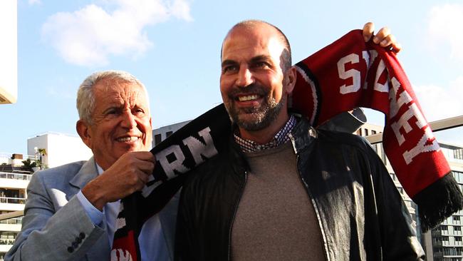 Western Sydney Wanderers Club Chairman Paul Lederer (left) places a scarf around Markus Babbel after Babbel 