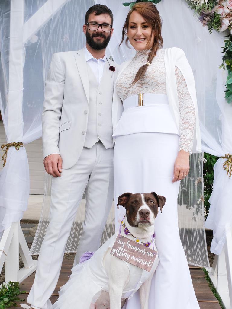 Geelong couple Laura Tasker and Corey Rufus walked down the aisle Sunday after five failed attempts due to COVID-19. The couple with pooch Arabella. Picture: Mark Wilson