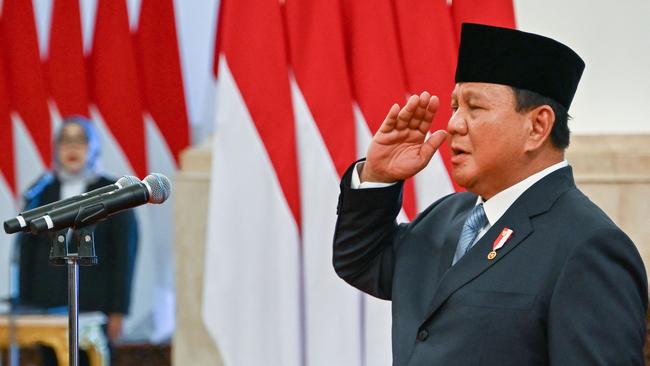 Indonesia's President Prabowo Subianto presides over the swearing-in ceremony of his cabinet ministers at the Presidential Palace in Jakarta on Monday. Picture: AFP