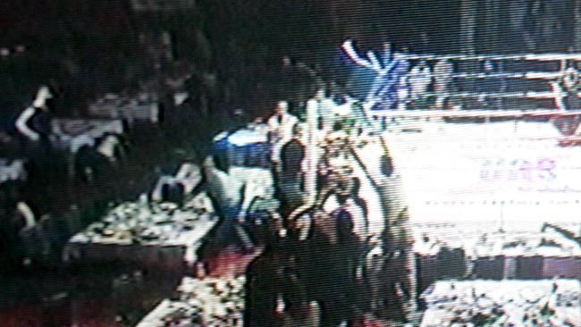 Nine News stills of a bikie gang brawl at a kickboxing fight at Royal Pines Resort.