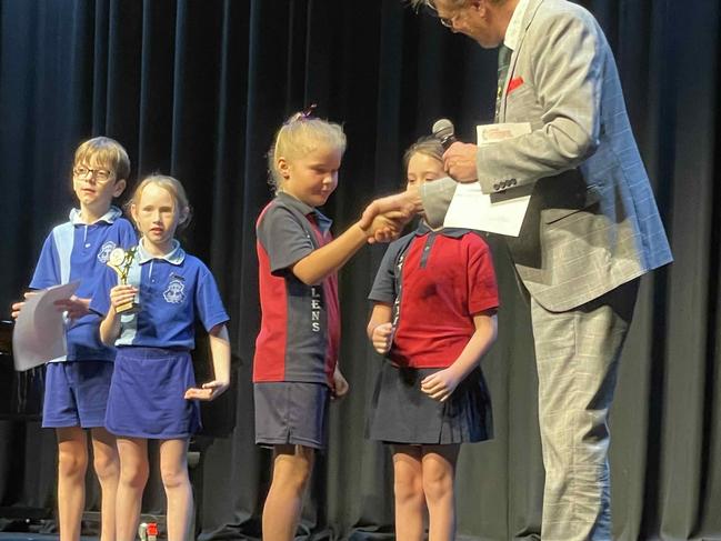 Warwick Tyrrell congratulates Tinana State School on winning their category at the Maryborough Eisteddfod, August 9. 2023