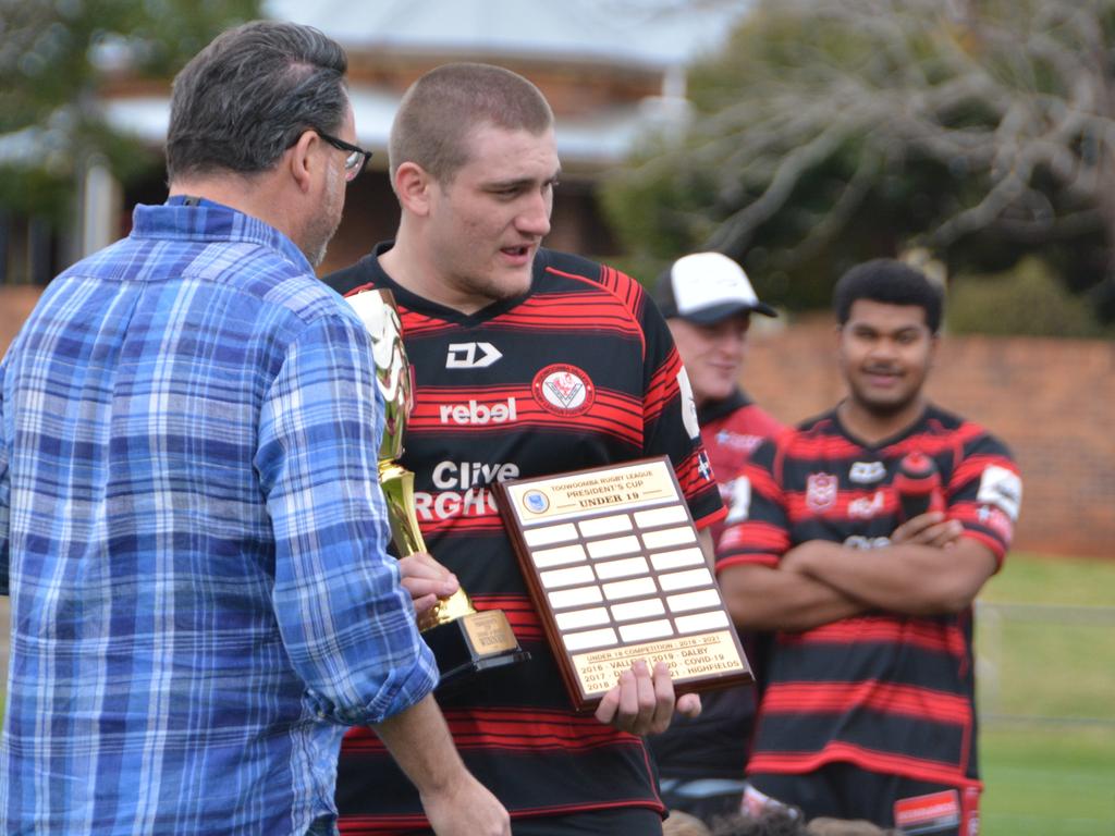 Valleys co-captain Kael Tremain being presented with the Cup.