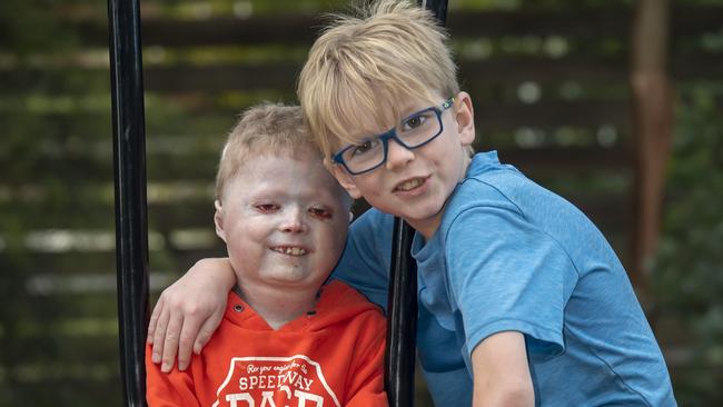 Harrison and Miller Pennicott are mad footy fans. Picture: Andy Brownbill