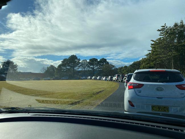 Long lines of cars are snaking their way around the Cavanbah Centre to be tested at Byron Bay.